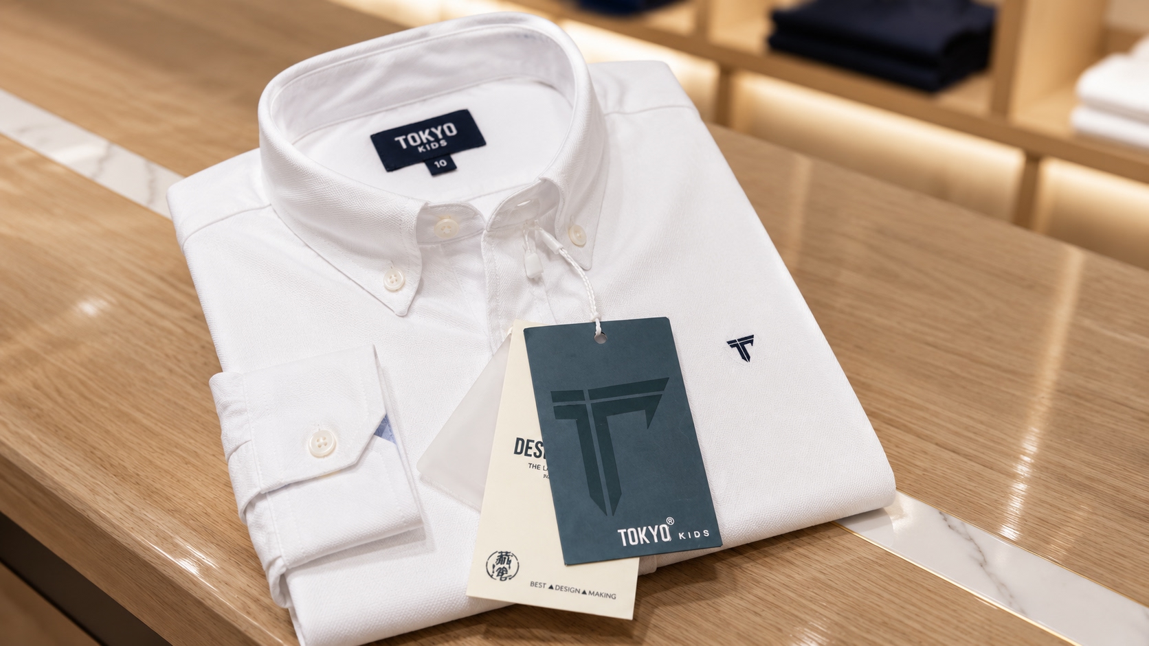 White kids shirt with woven neck label and grey hang tag by Shree Krishna Labels